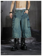 NOMANIAI  Washed, distressed, loose-fit cropped pants with multiple pockets.