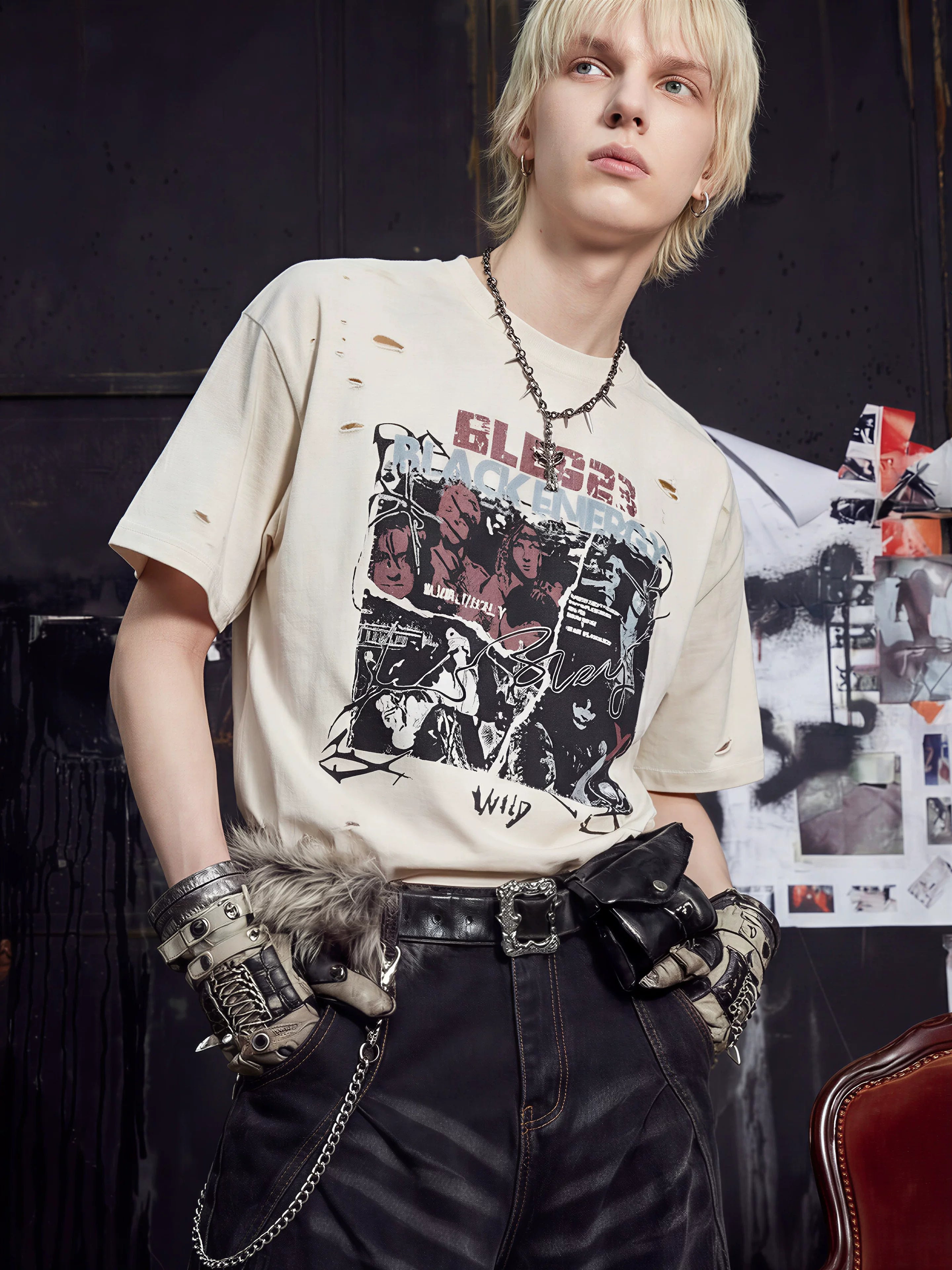 NOMANIAI Distressed Short-Sleeve T-Shirt with Rips and Vintage-Style Print.