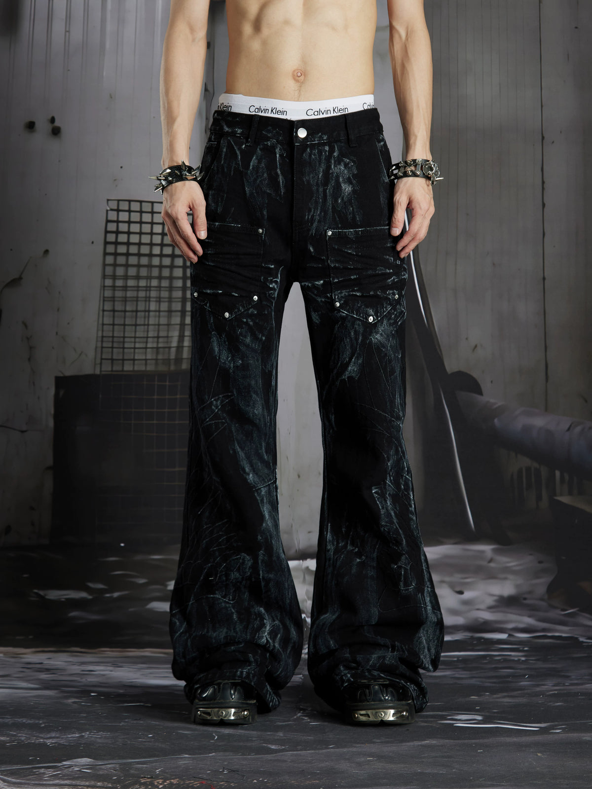NOMANIAI Dark Street-Style Denim Jeans with Angel Wing Embroidery and Studs.