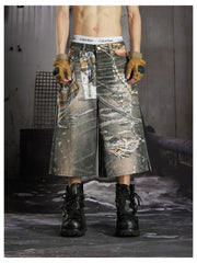 NOMANIAI  Loose-fit cropped trousers featuring a 3D-printed plaid pattern and chain detailing.
