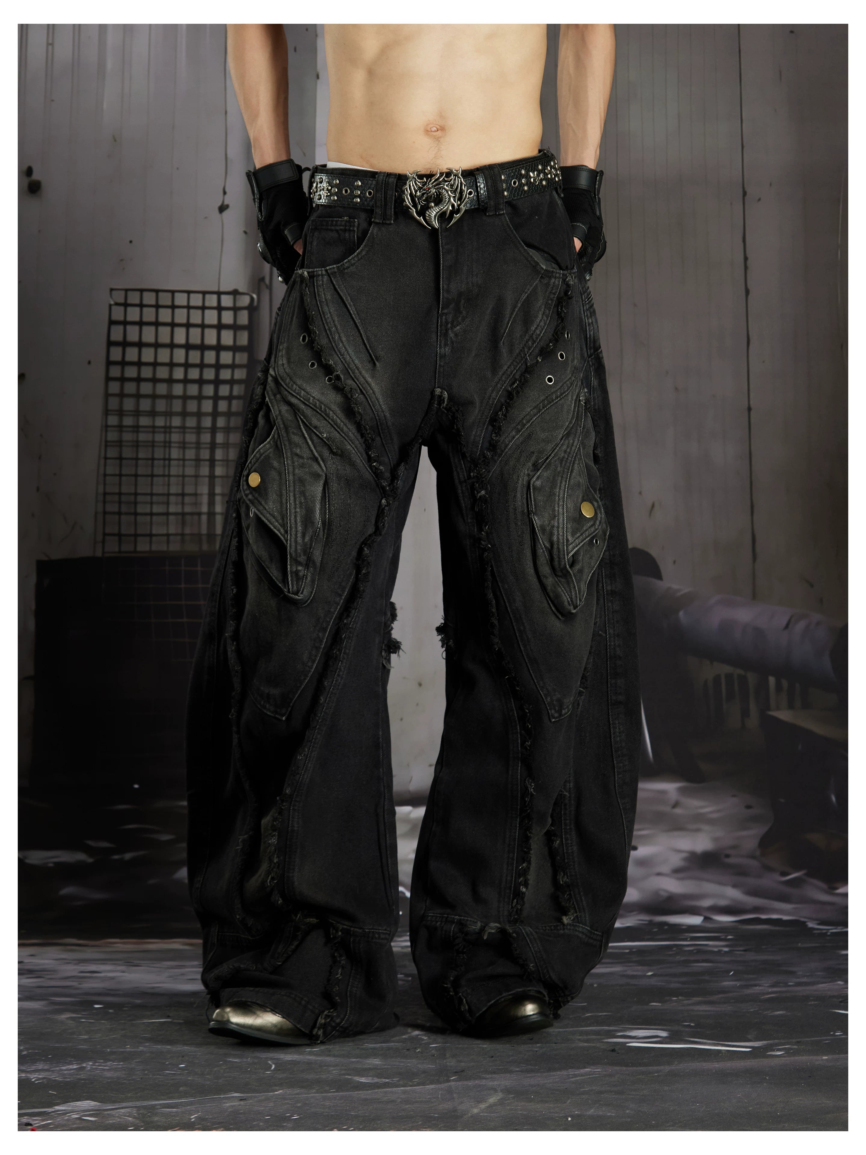 NOMANIAI  Heavy-duty distressed loose-fit curved-seam jeans.
