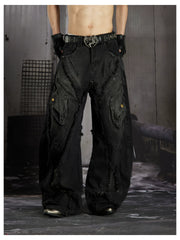 NOMANIAI  Heavy-duty distressed loose-fit curved-seam jeans.