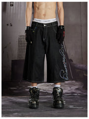 NOMANIAI Cropped jeans with rhinestone and embroidery totem design.