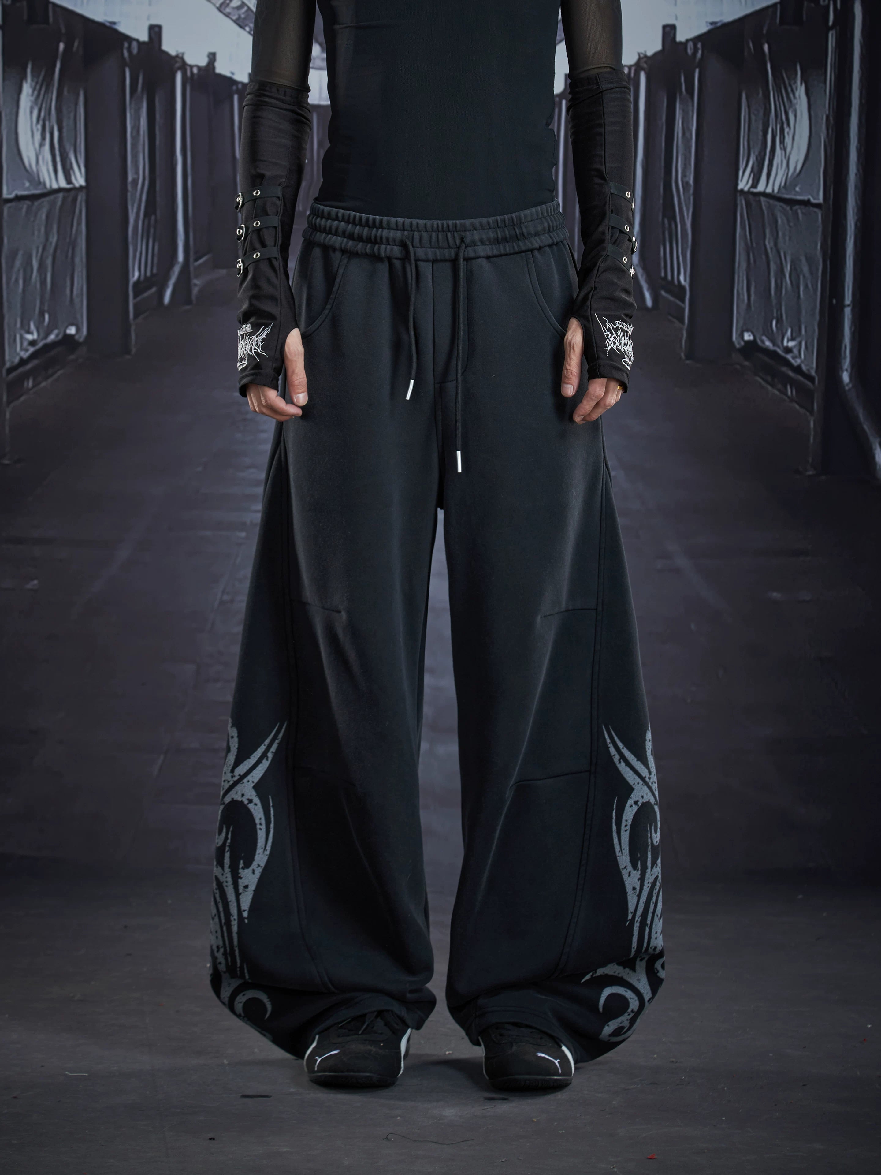 NOMANIAI  Loose-fit casual trousers with a washed, distressed finish and totem print.