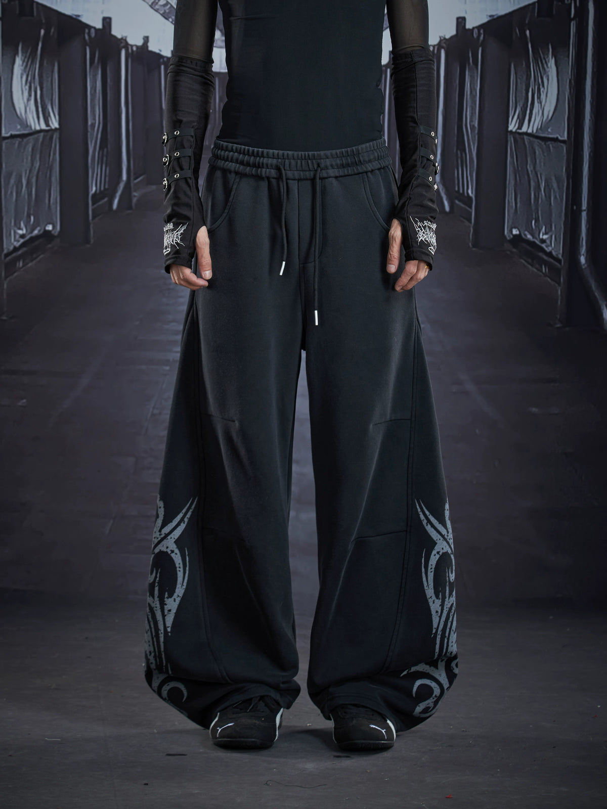 NOMANIAI  Loose-fit casual trousers with a washed, distressed finish and totem print.