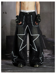 NOMANIAI  Hand-painted star and stud detail wide-leg jeans with a washed, distressed finish.