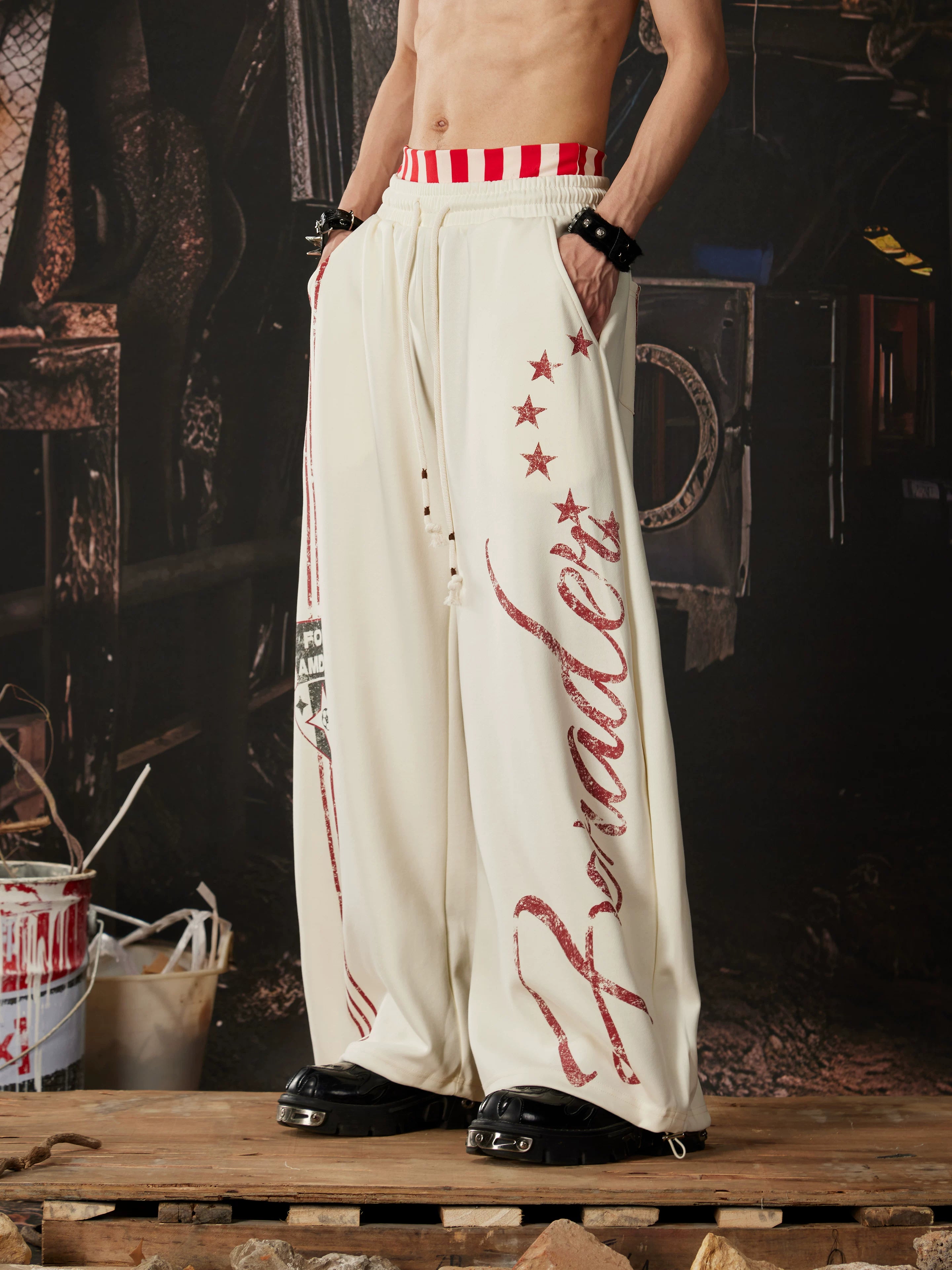 NOMANIAI  Printed Y2K loose-fit casual pants with double-waistband detail.