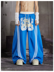 NOMANIAI  Y2K Graffiti-Print Casual Pants with Double-Layer Waistband and Three-Stripe Detail.