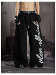 NOMANIAI  Loose-fit casual trousers with double-waistband design and totem print.