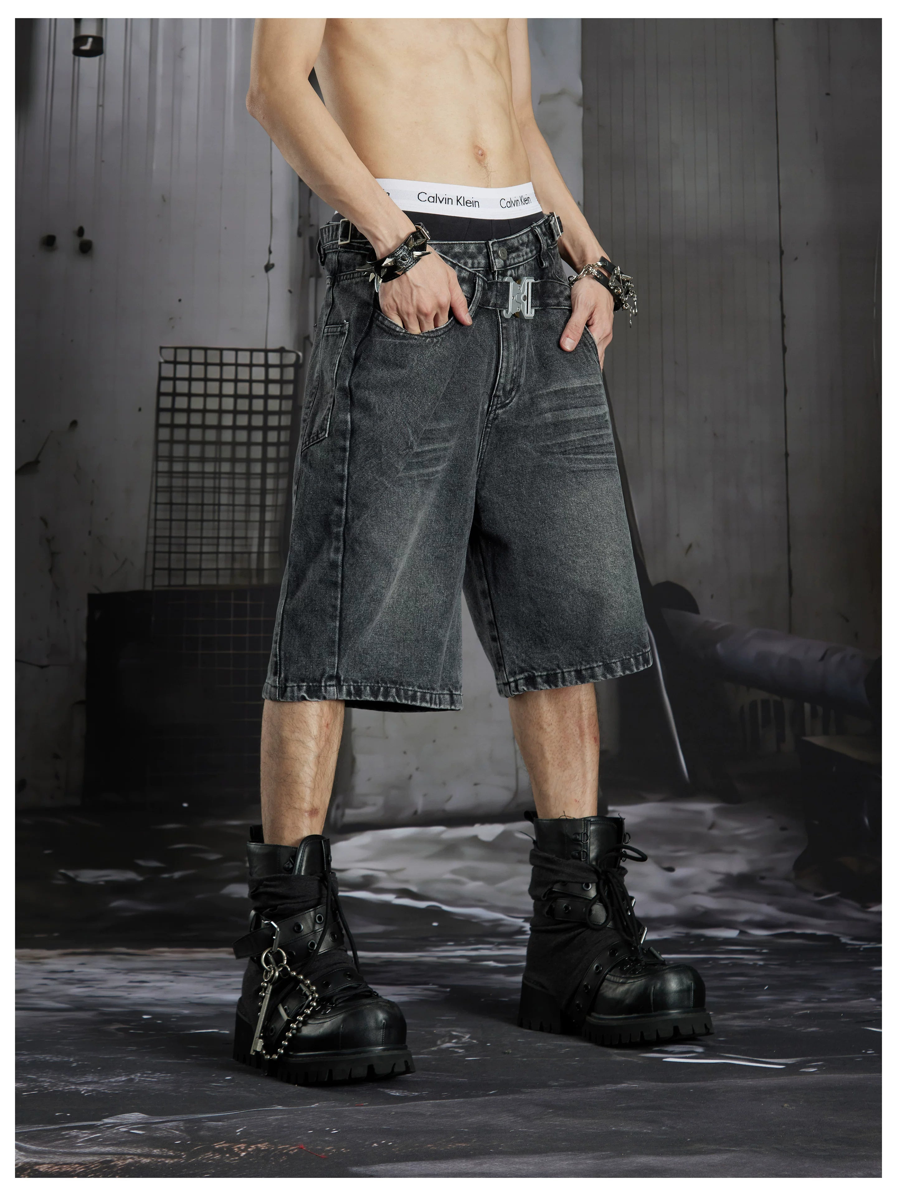 NOMANIAI Deconstructed double-waistband distressed loose-fit denim shorts.