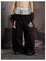 NOMANIAI  Street-style loose-fit casual trousers with double-waistband embroidery.
