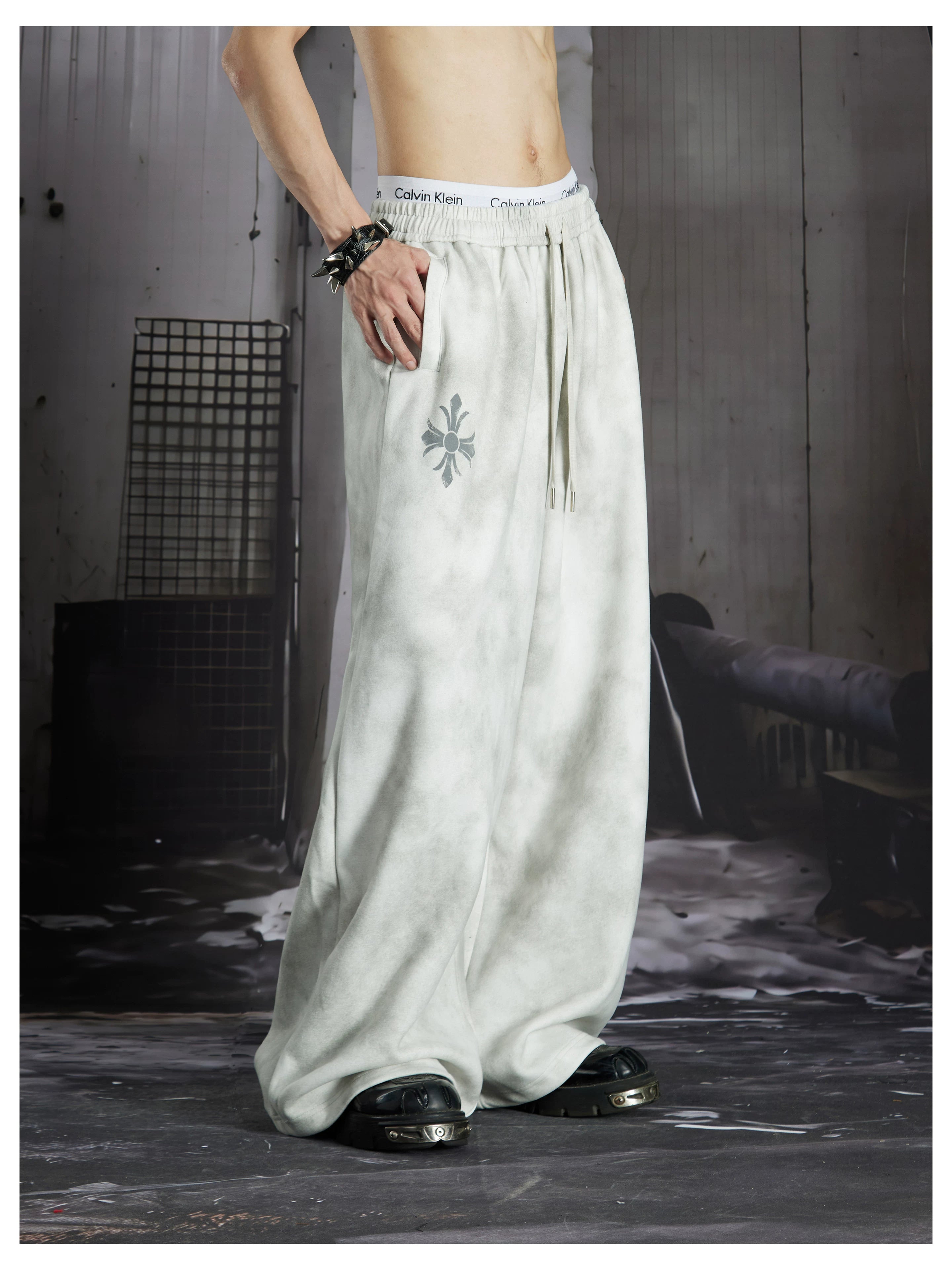 NOMANIAI  Y2K Cross-Print Tie-Dye Loose-Fit Casual Pants with Elastic Waist.