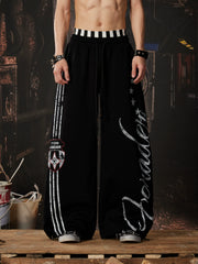 NOMANIAI  Printed Y2K loose-fit casual pants with double-waistband detail.