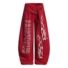 NOMANIAI Loose-fitting trousers with a totem print and Y2K-style lace-up detailing.