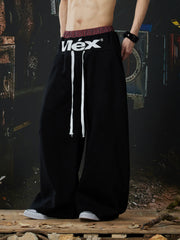NOMANIAI  Street-style double-waistband sweatpants with attached skirt detail – casual dance pants.