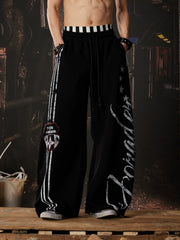 NOMANIAI  Printed Y2K loose-fit casual pants with double-waistband detail.