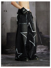 NOMANIAI  Hand-painted star and stud detail wide-leg jeans with a washed, distressed finish.