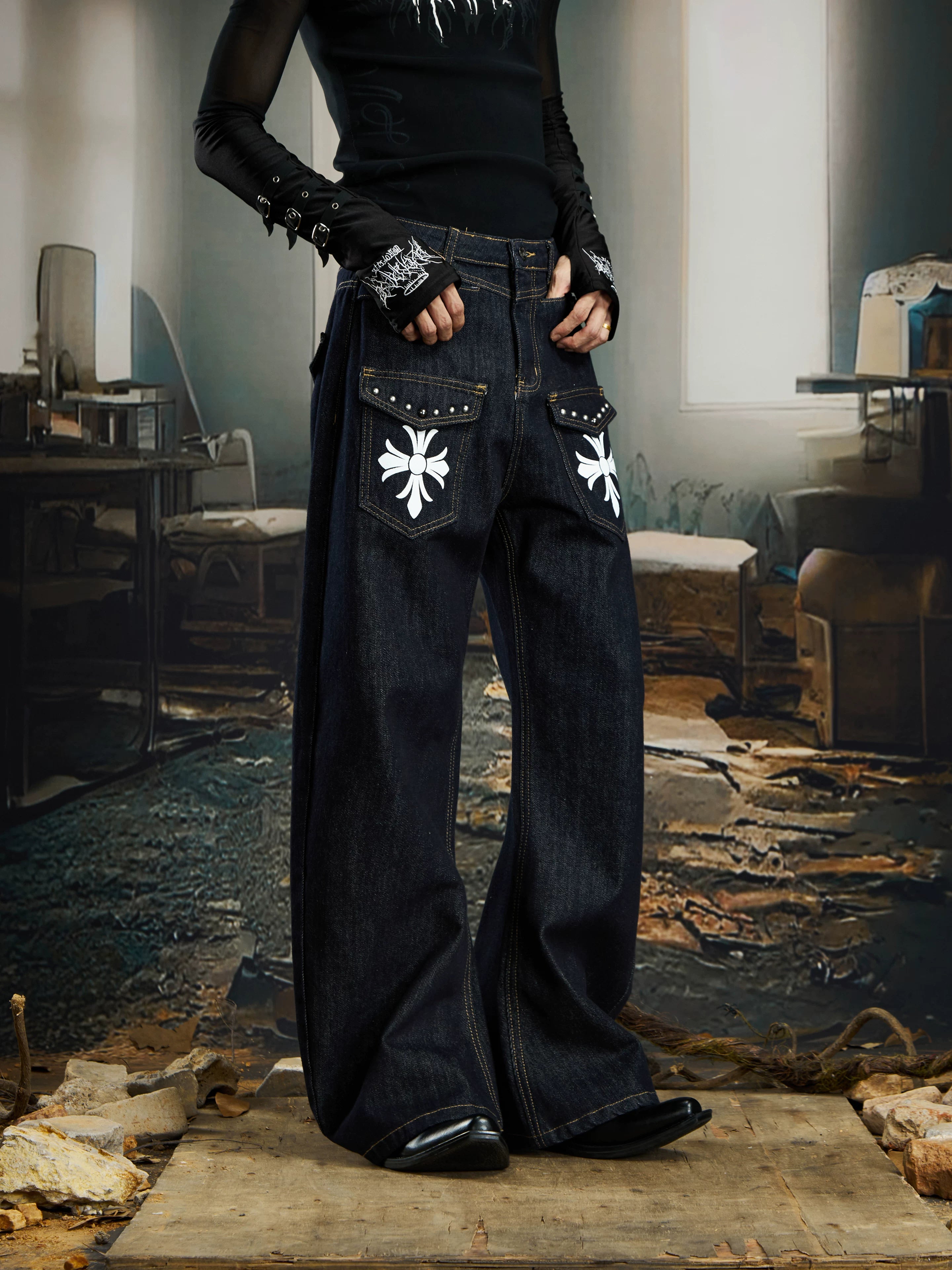 NOMANIAI  Printed, studded, deconstructed "Scimitar" jeans—versatile trousers.