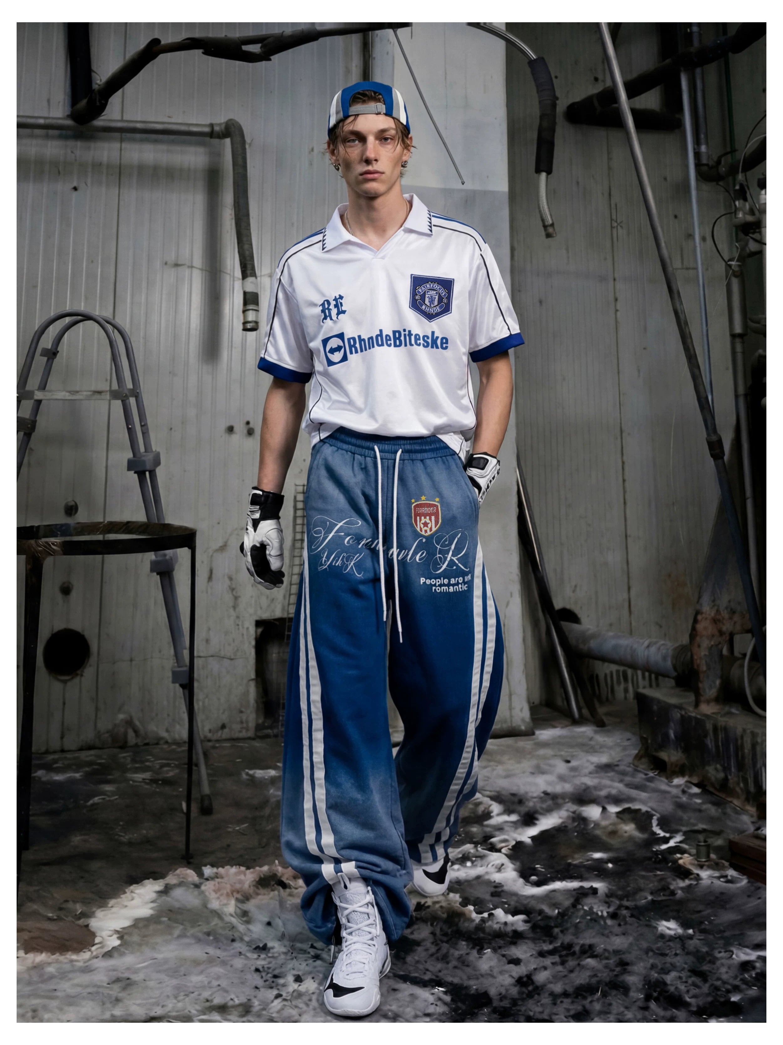 NOMANIAI Street-style distressed print loose-fit sweatpants.