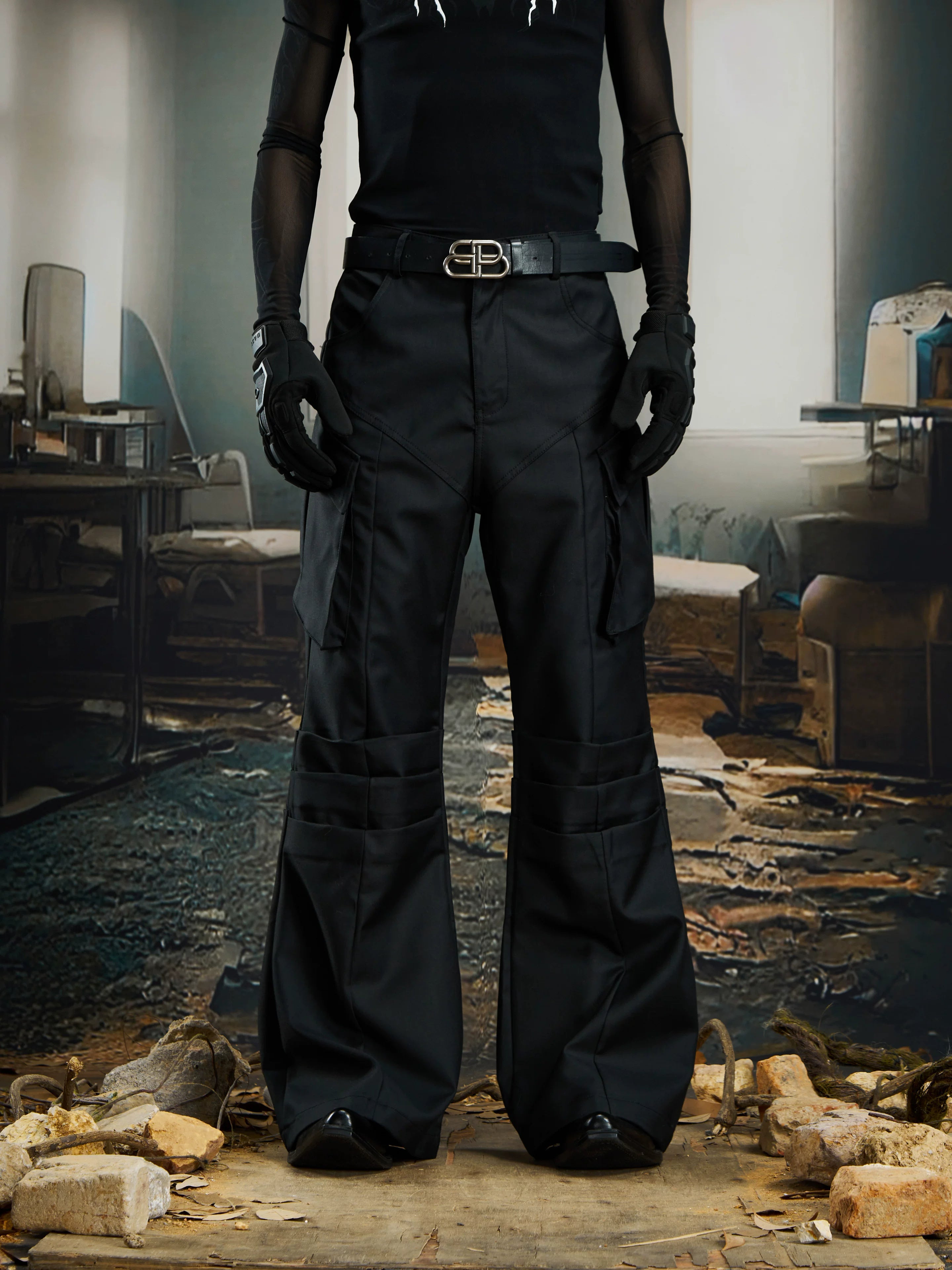 NOMANIAI  Niche, sophisticated slightly flared trousers with a utility-style aesthetic.