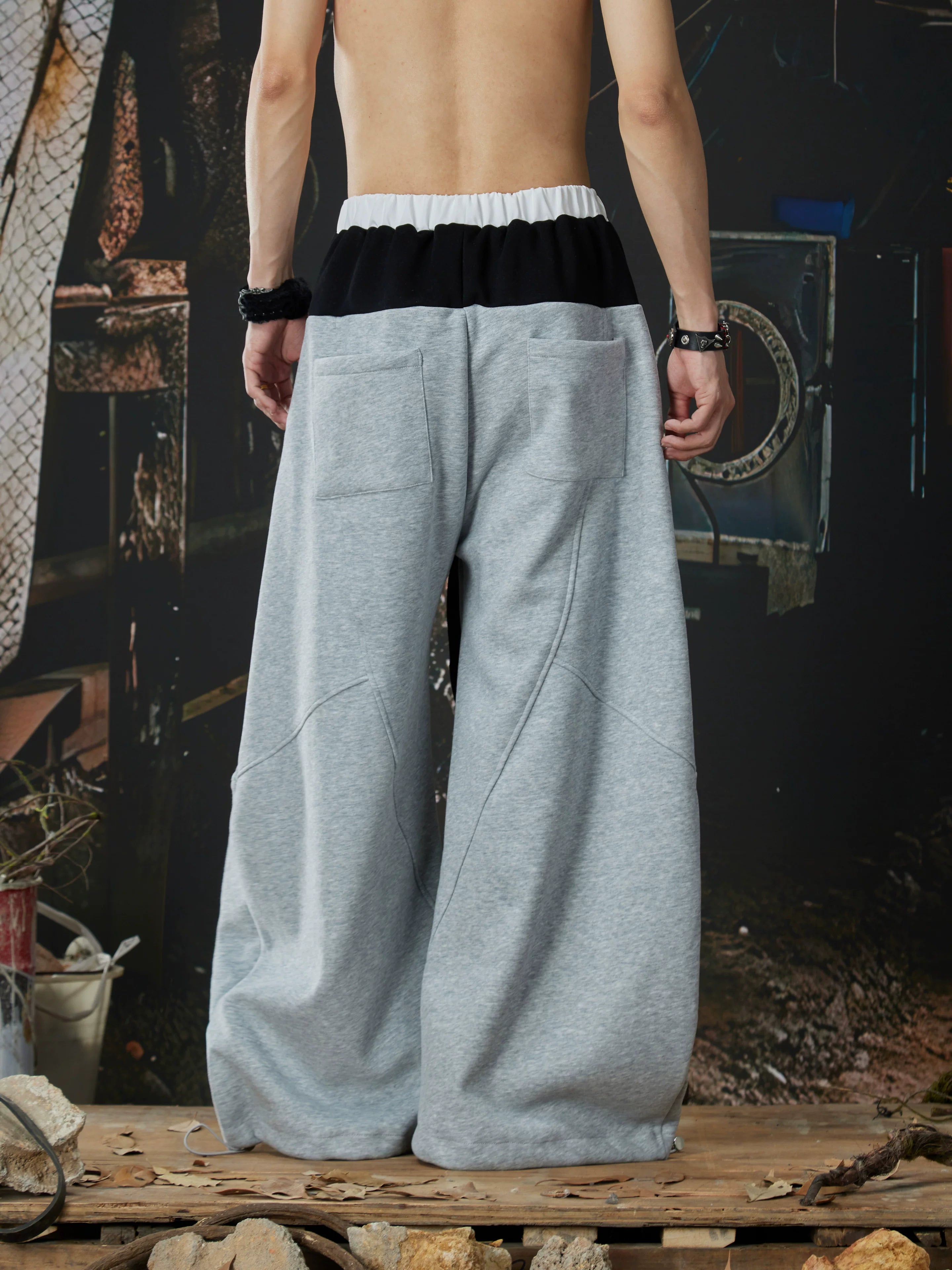 NOMANIAI  Street-style double-waistband sweatpants with attached skirt detail – casual dance pants.