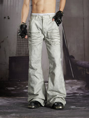 NOMANIAI Edgy, dark-style street-look flared jeans with paint-splatter and stud details.