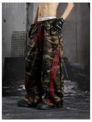 NOMANIAI Street-style embroidered camouflage casual pants with three-stripe detailing.