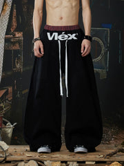 NOMANIAI  Street-style double-waistband sweatpants with attached skirt detail – casual dance pants.
