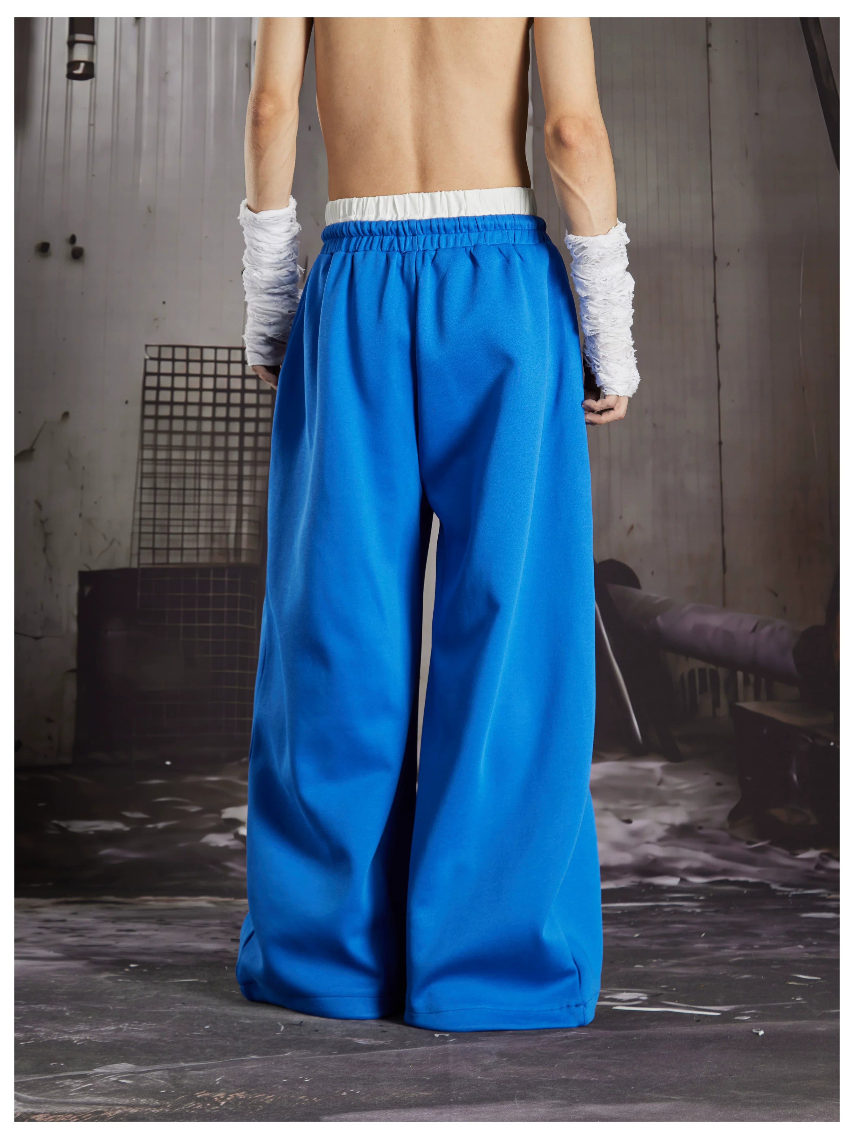 NOMANIAI  Y2K Graffiti-Print Casual Pants with Double-Layer Waistband and Three-Stripe Detail.