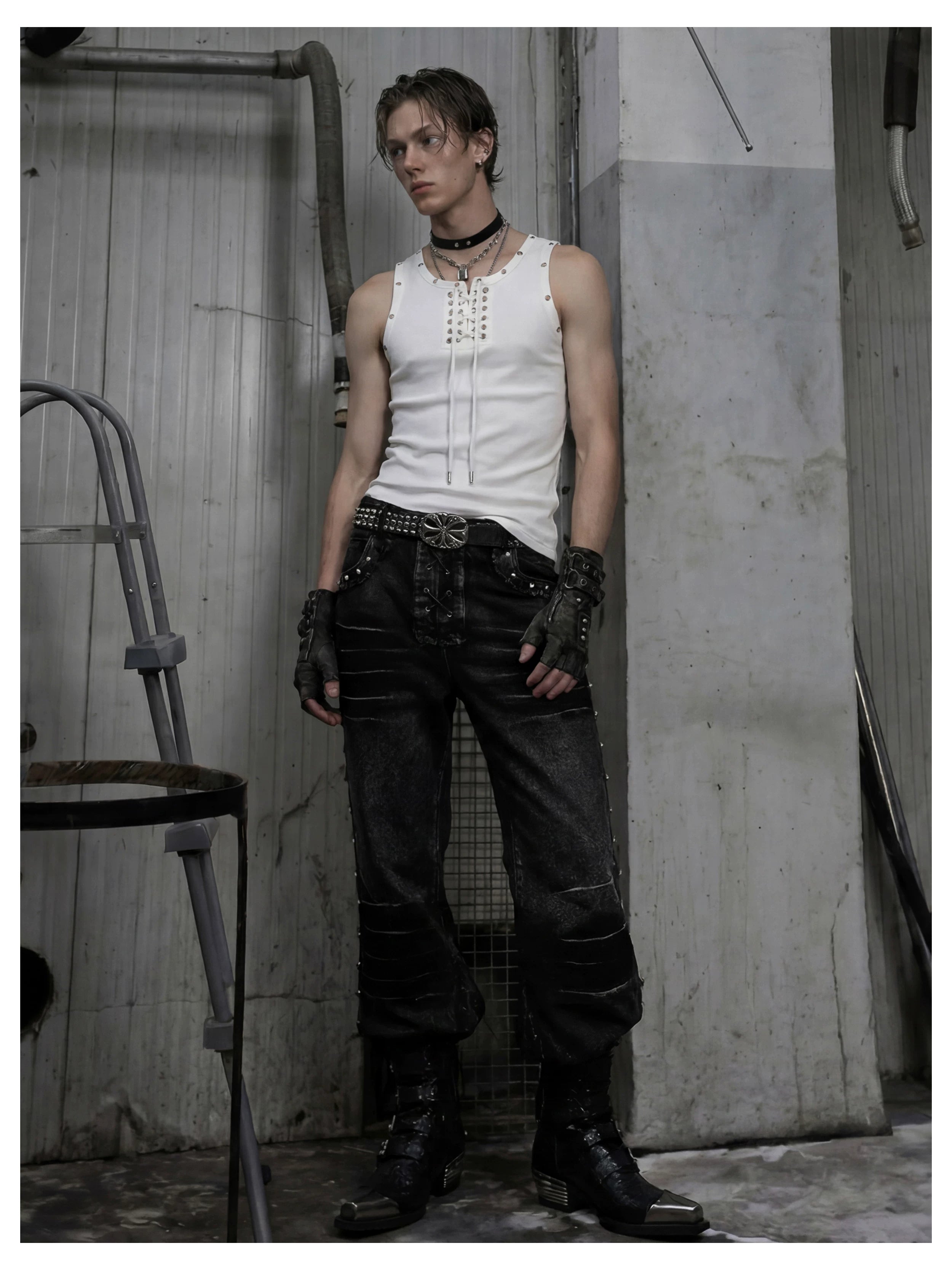 NOMANIAI Distressed, slim-fit, slight-flare jeans with studs—dark streetwear style.