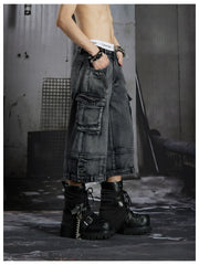 NOMANIAI  Washed, distressed, loose-fit cropped pants with multiple pockets.