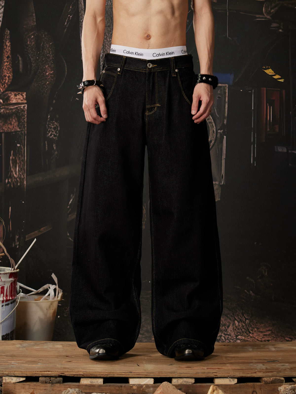 NOMANIAI  Embroidered-waistband loose-fit jeans.