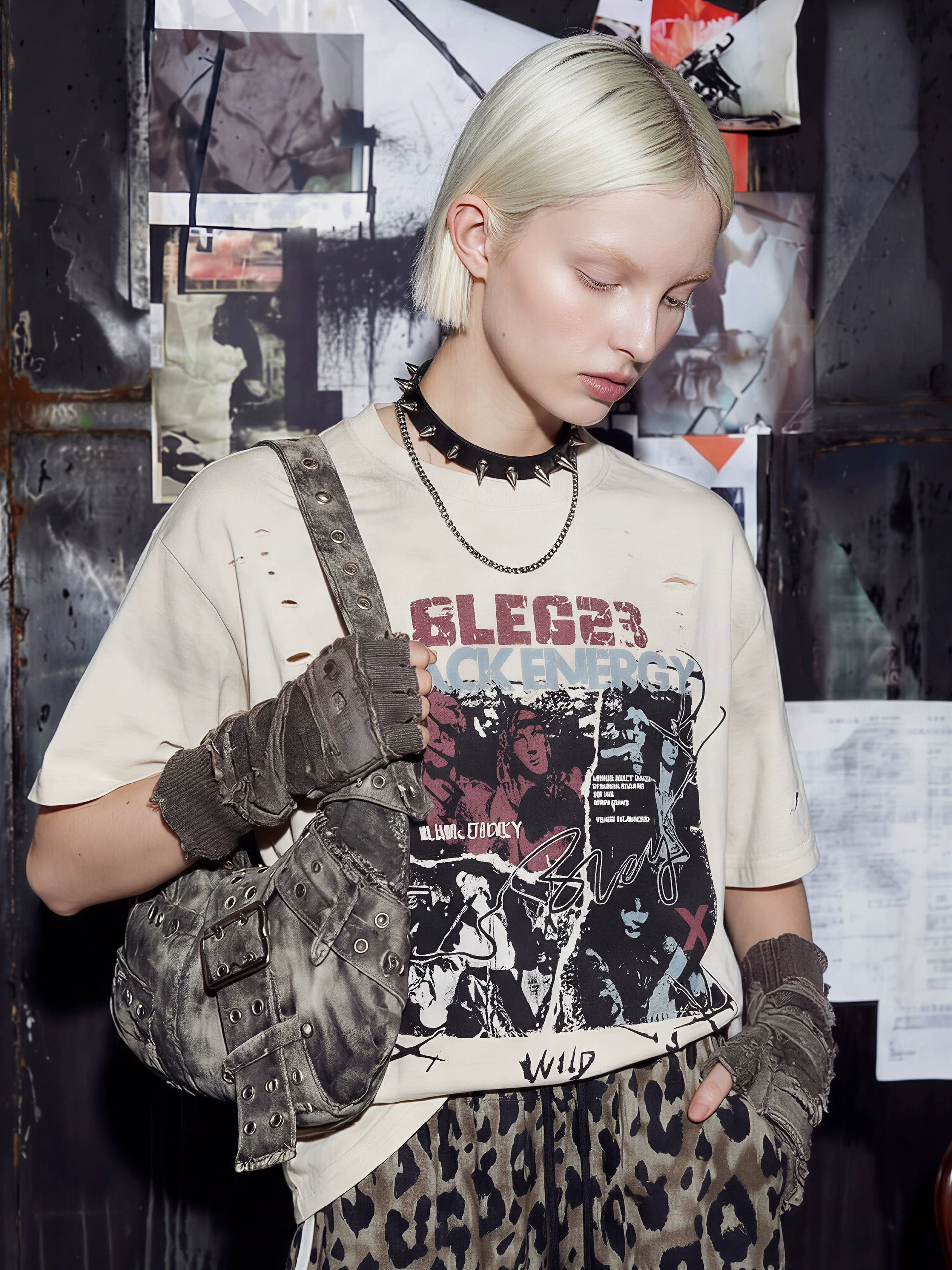 NOMANIAI Distressed Short-Sleeve T-Shirt with Rips and Vintage-Style Print.