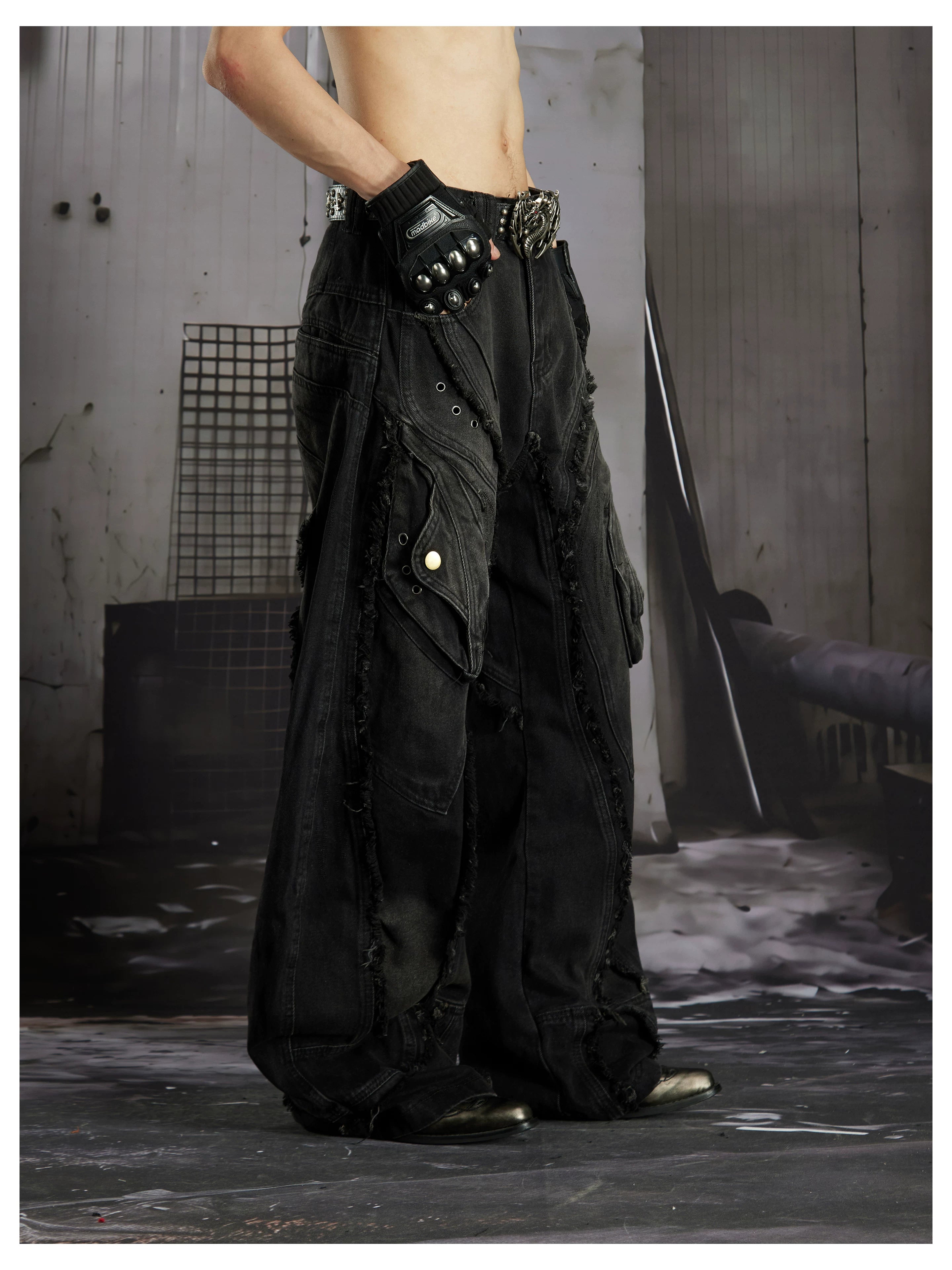 NOMANIAI  Heavy-duty distressed loose-fit curved-seam jeans.