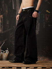 NOMANIAI  Embroidered-waistband loose-fit jeans.
