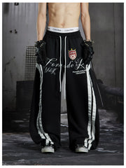 NOMANIAI Street-style distressed print loose-fit sweatpants.
