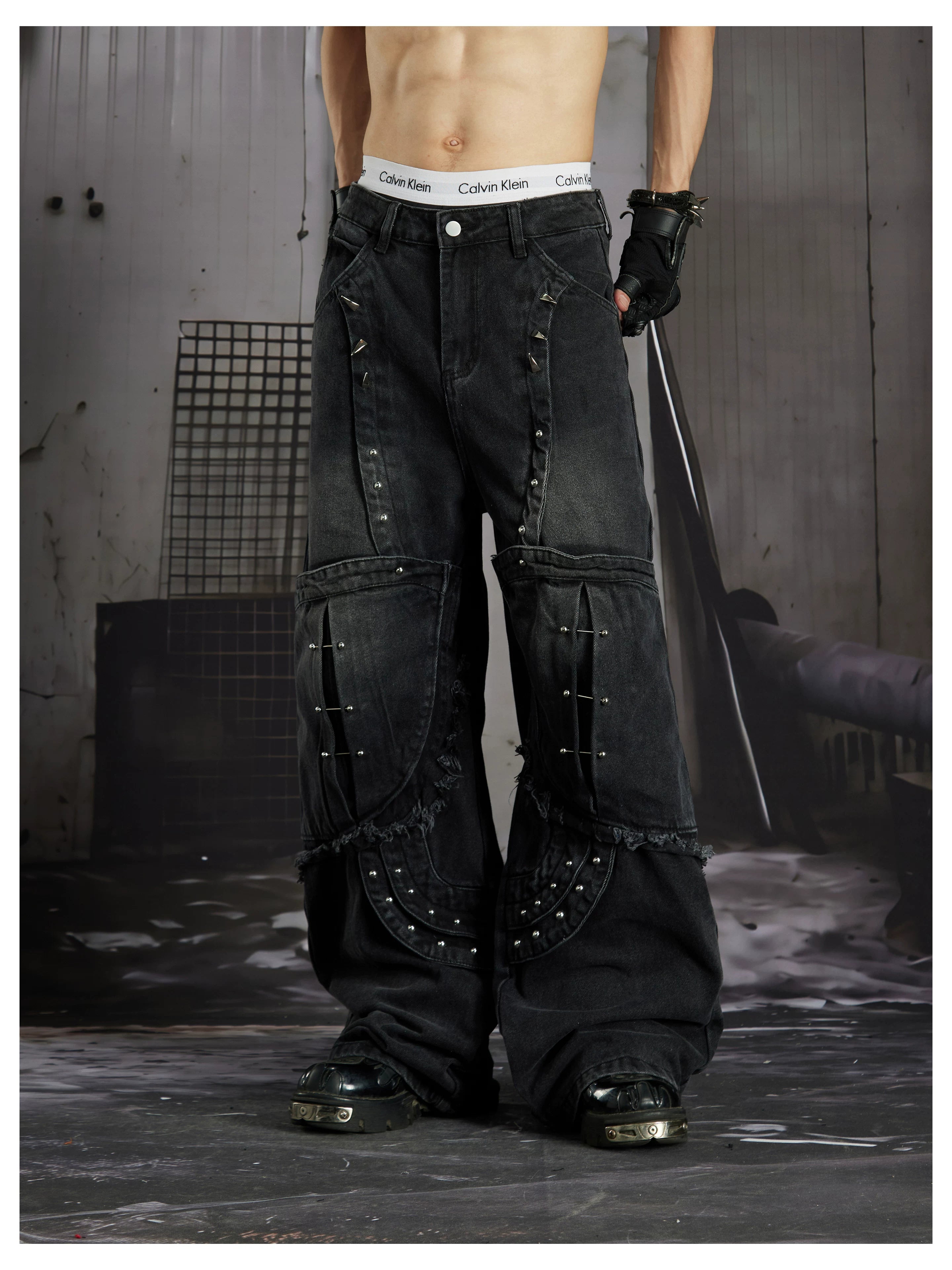 NOMANIAI  Panel-construction straight-leg jeans with rivets and a distressed wash.