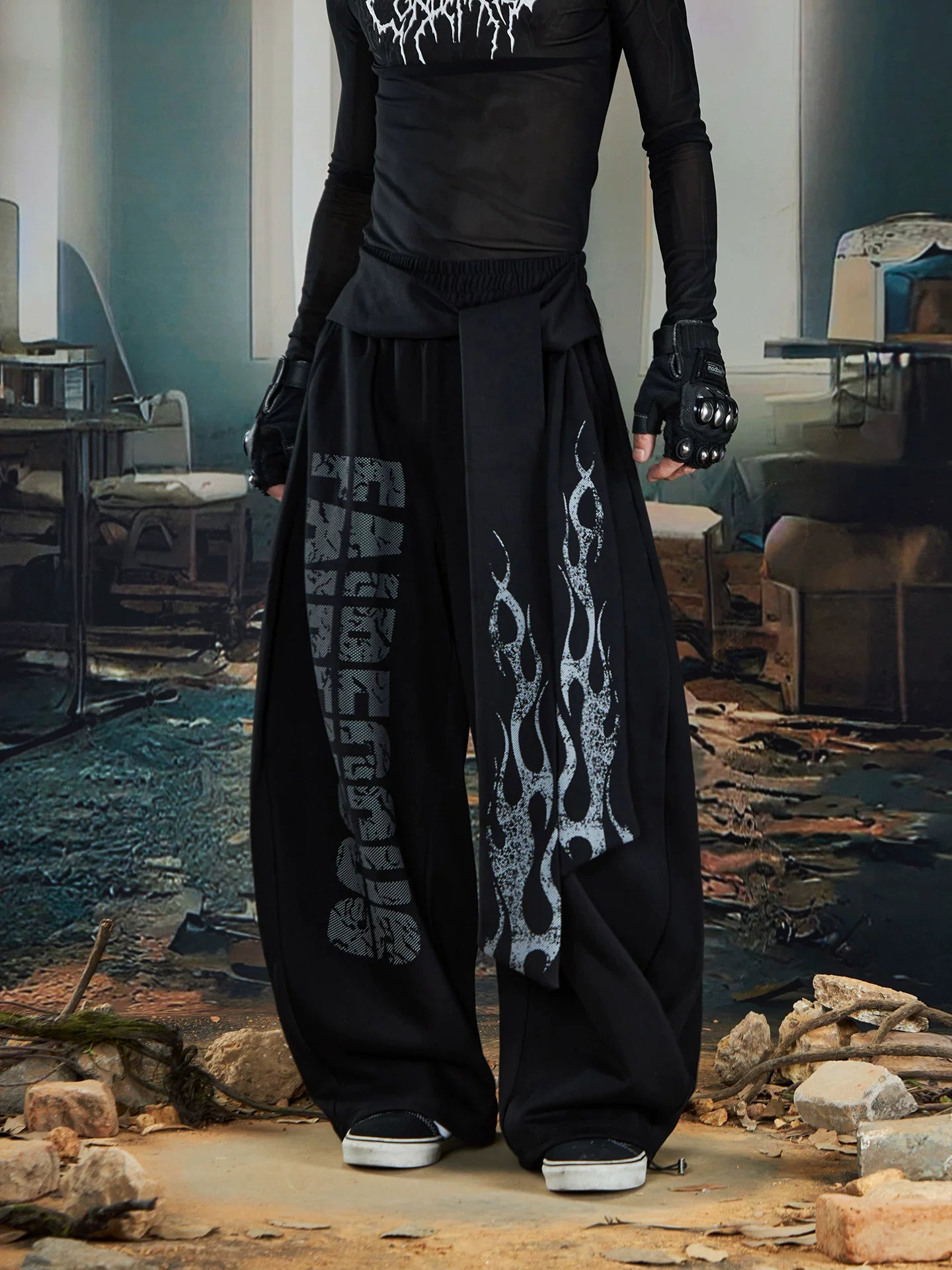 NOMANIAI Loose-fitting trousers with a totem print and Y2K-style lace-up detailing.