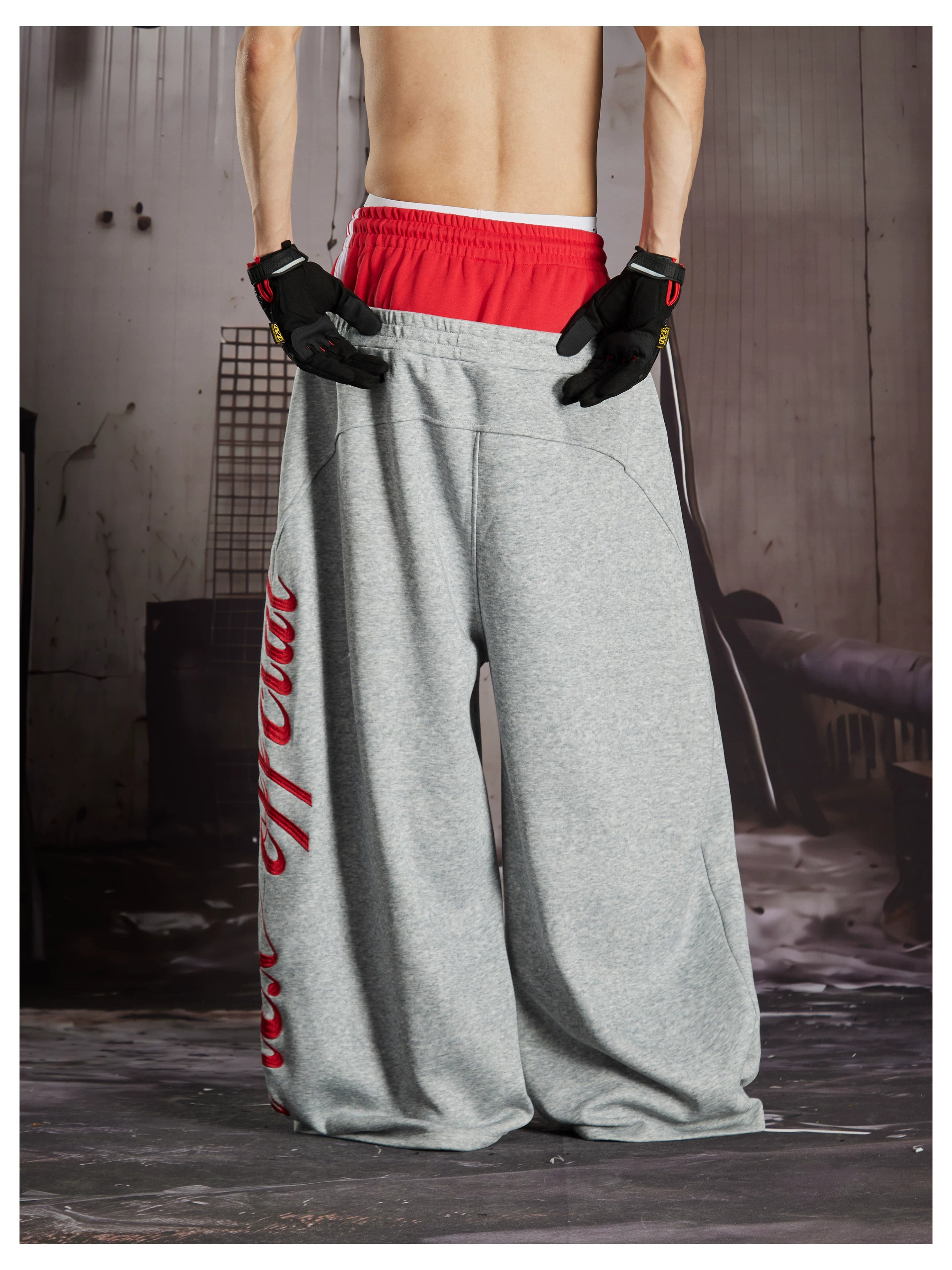 NOMANIAI  Street-style loose-fit casual trousers with double-waistband embroidery.